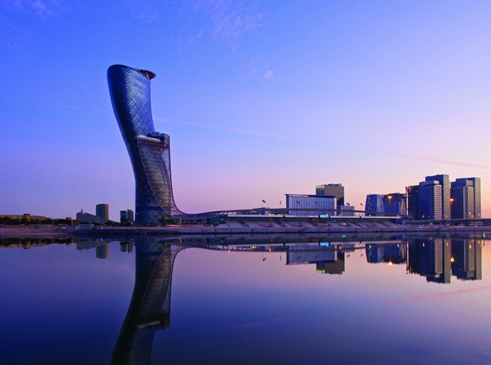 Capital Gate Building and Skyline Reflection 4K