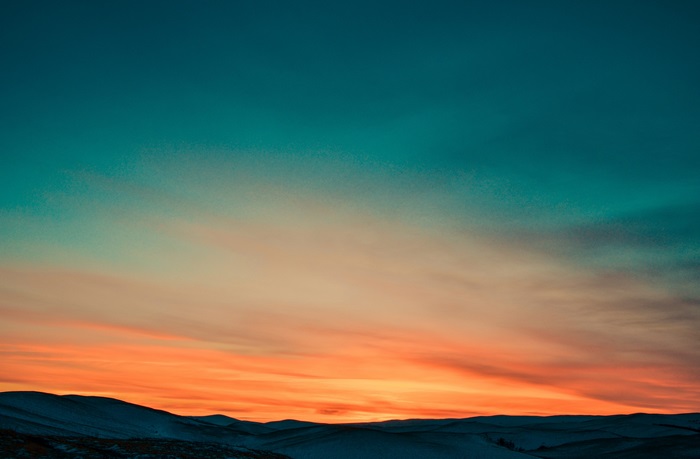 Sunset over rolling hills 4K