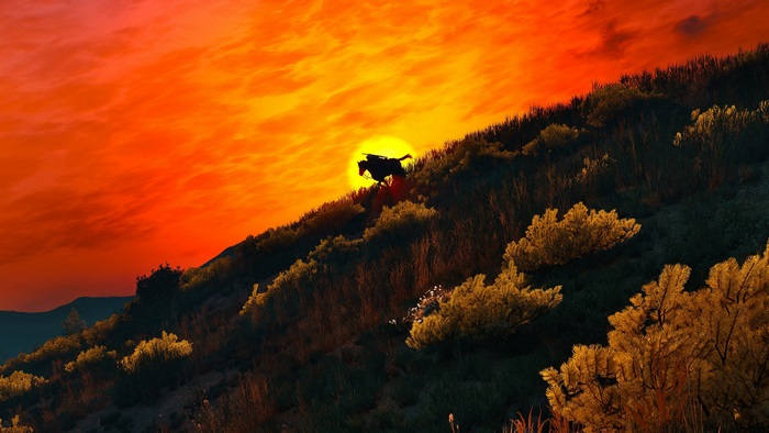 Geralt riding a horse at sunset in The Witcher 3