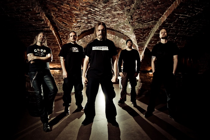 Meshuggah band members in a brick tunnel