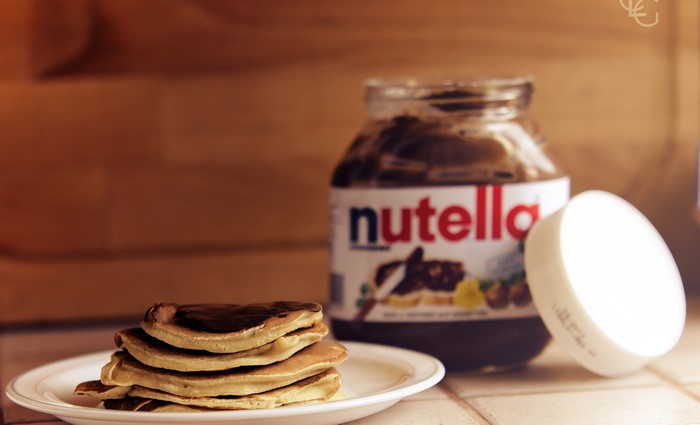 Stack of pancakes with Nutella jar
