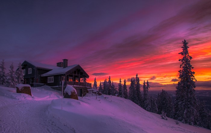 Cozy Winter Cottage Sunset in Snowy Norwegian Forest