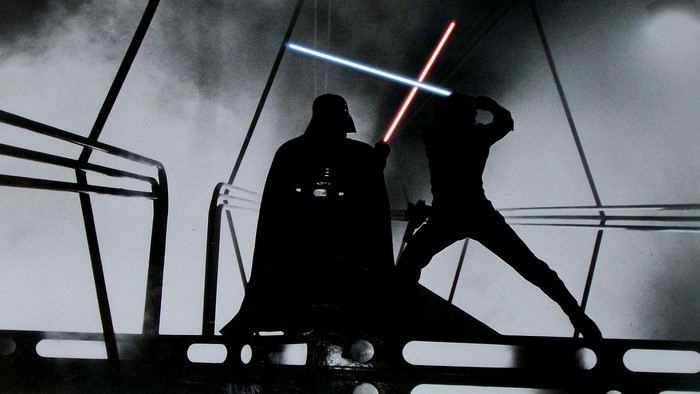 Darth Vader and Luke Skywalker duel with lightsabers