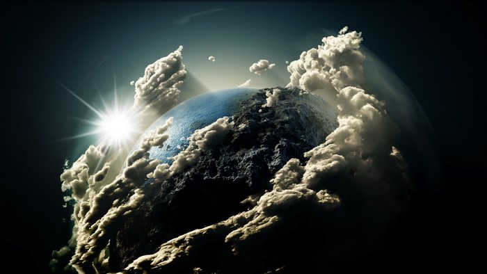 Earth surrounded by clouds with sun rays