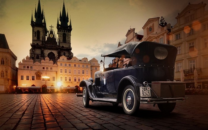 Vintage car parked in old European square