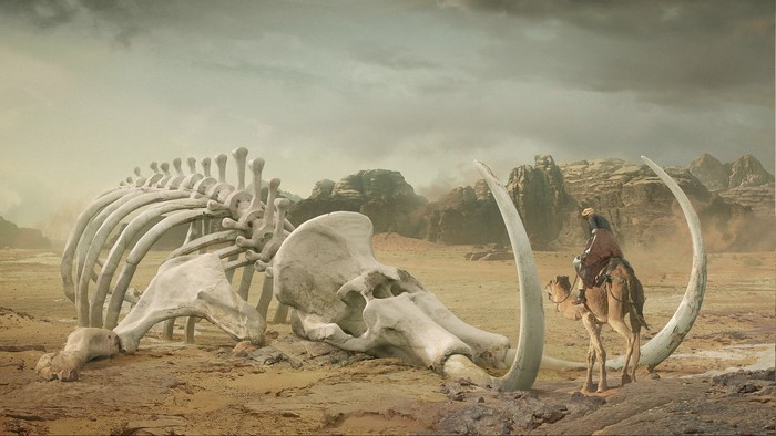 Desert Scene with Giant Mammoth Skeleton and Rider