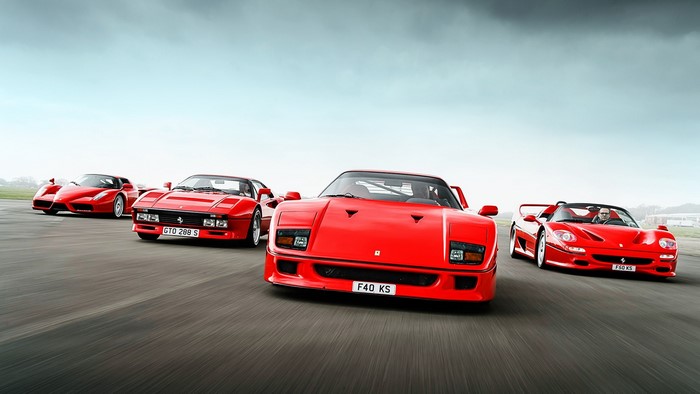 Ferrari Enzo, F40, F50, and 288 GTO on a track