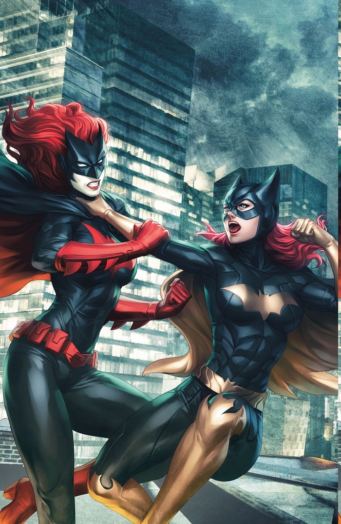 Batgirl and Batwoman fighting on a rooftop