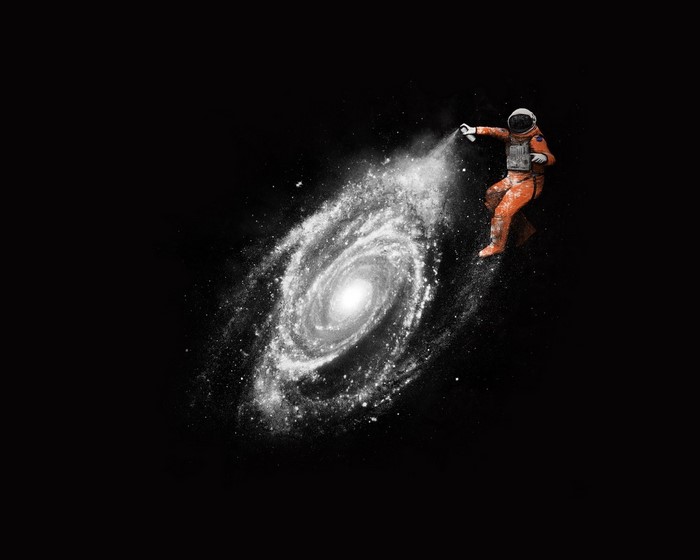 Astronaut spraying a galaxy