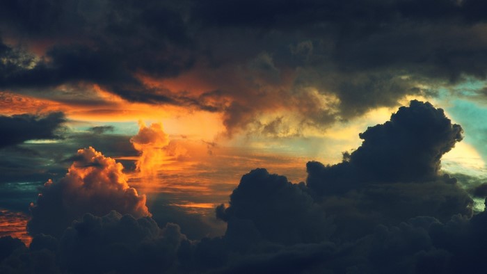 Dramatic sunset clouds with orange and dark hues