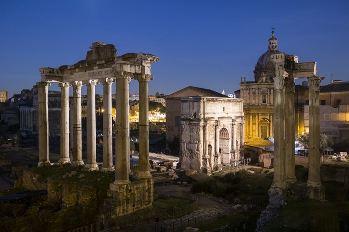 Roman Forum ruins and church at dusk