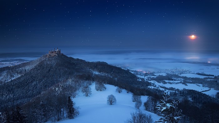 Hohenzollern Castle at night in winter