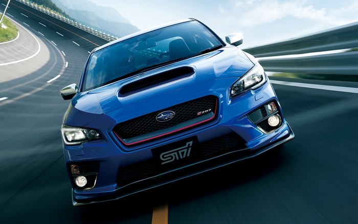 Blue Subaru WRX STI on a Winding Road