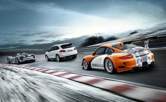 Porsche 918 Spyder, Cayenne, and 911 GT3 on a Racetrack