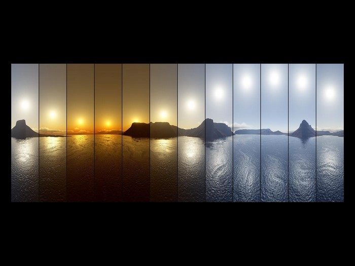 Time lapse of sun over a lake and mountains