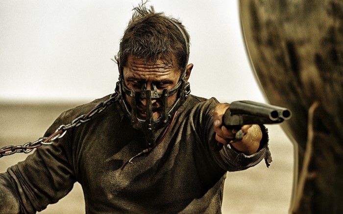 Max from Mad Max: Fury Road holding a shotgun