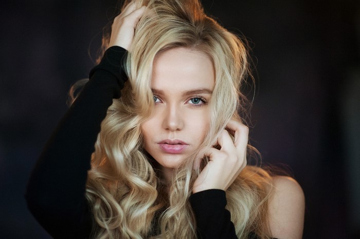 Woman with blonde hair and blue eyes