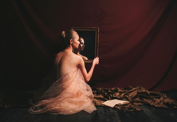 Woman looking in a mirror