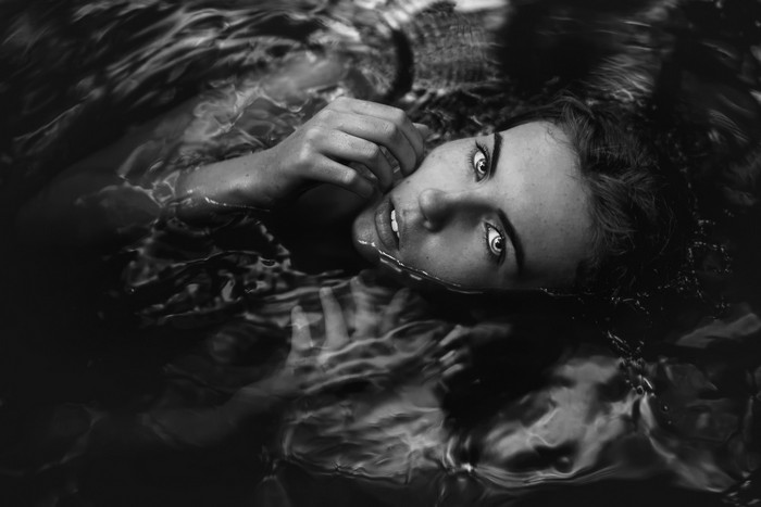 Monochrome portrait of a woman in water