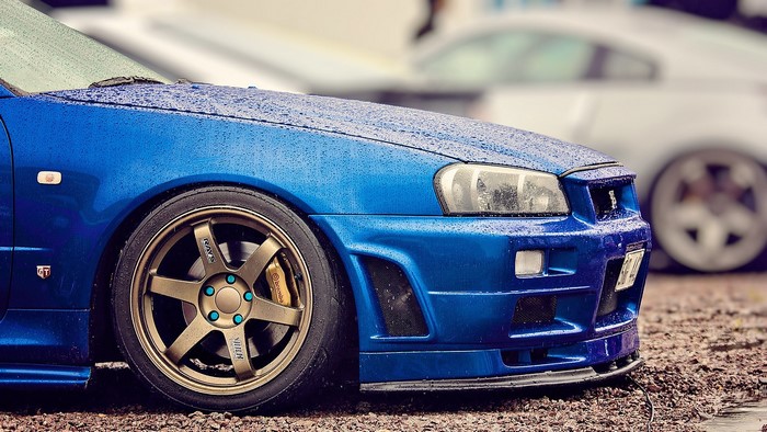 Blue Nissan Skyline GT-R R34 in the Rain