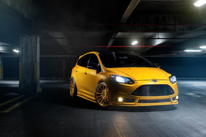 Yellow Ford Focus ST in a parking garage
