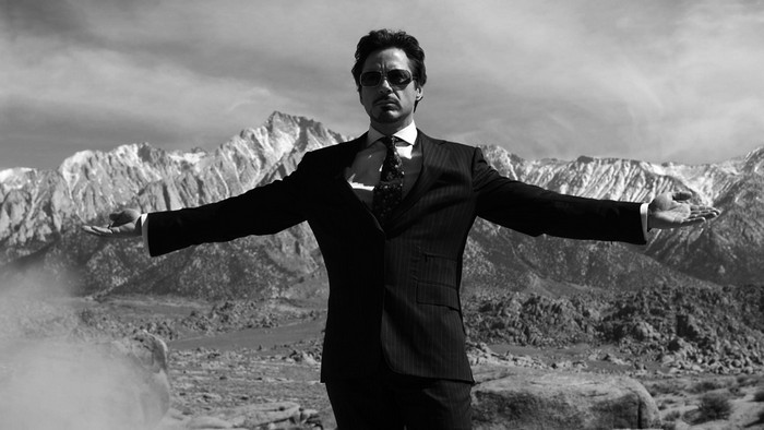 Tony Stark from Iron Man in a suit with mountains