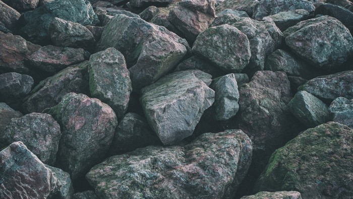 Pile of textured rocks with moss