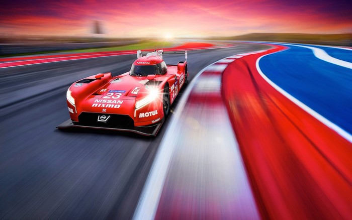 Red Nissan NISMO Racing Car on Track