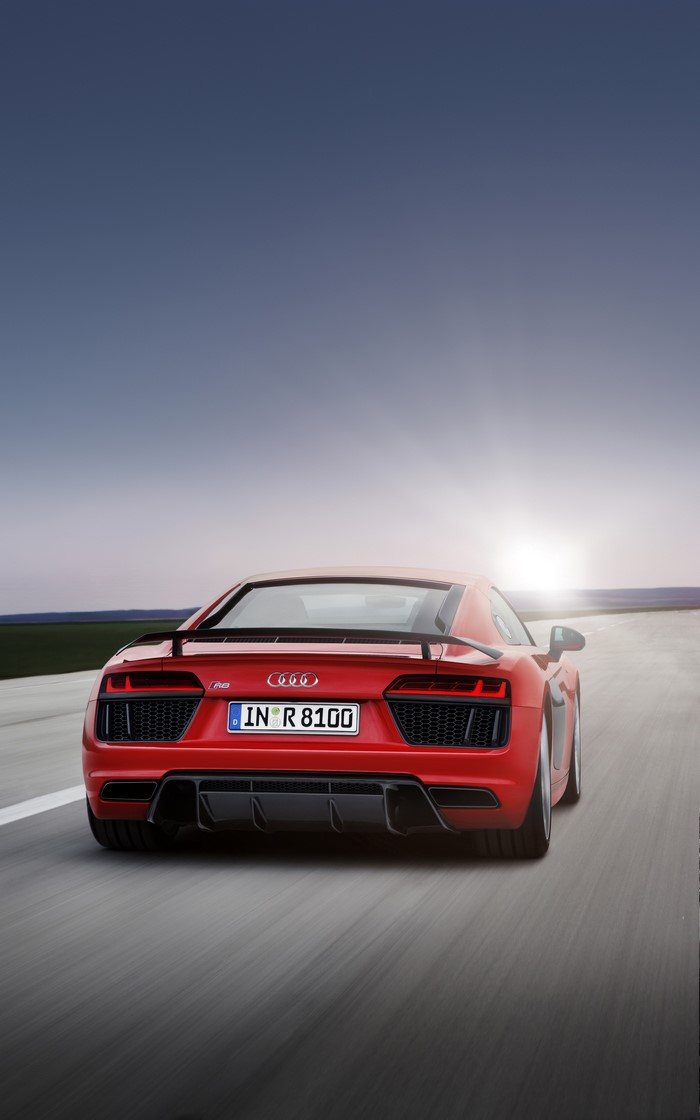 Red Audi R8 driving on a road