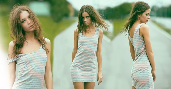 Woman in striped dress on a road