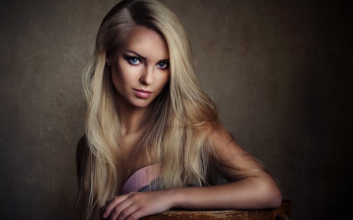Woman with long blonde hair and blue eyes