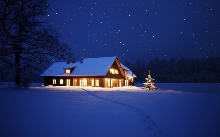 Cozy Cabin in Snow Under Starry Night Sky