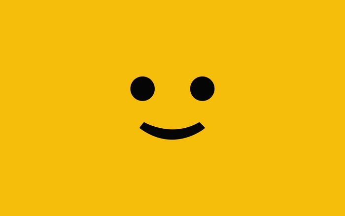 Minimalist smiley face on yellow background