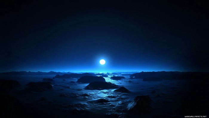 Moonlit rocky landscape with glowing moon