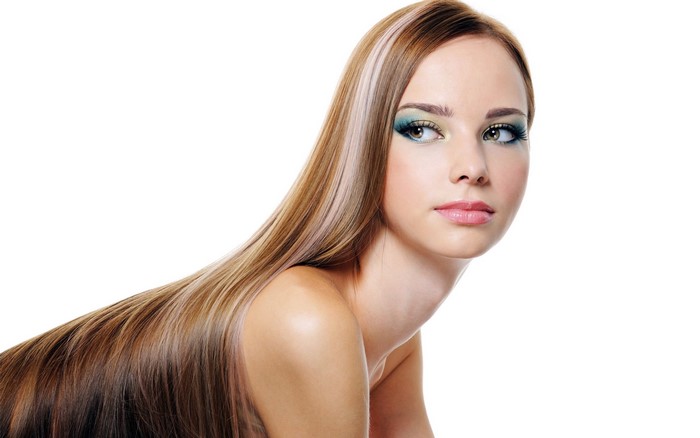 Woman with long brown and blonde highlighted hair