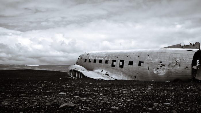 Wrecked airplane on a black sand beach in Iceland