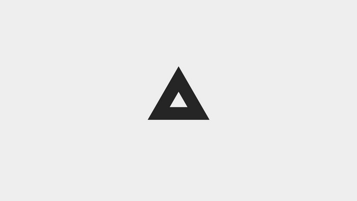 Minimalist Black Triangle on Light Gray Background