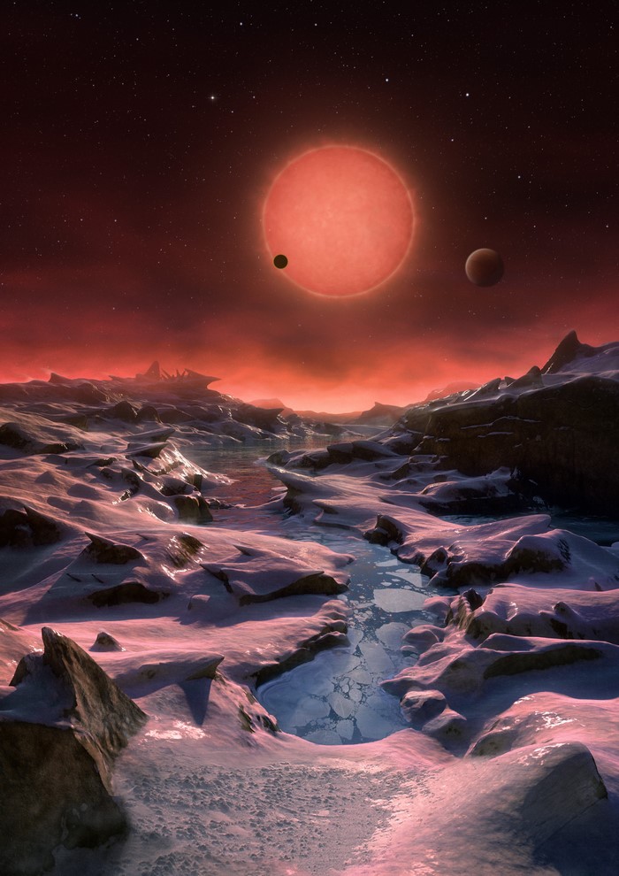Alien planet with red sun and icy landscape