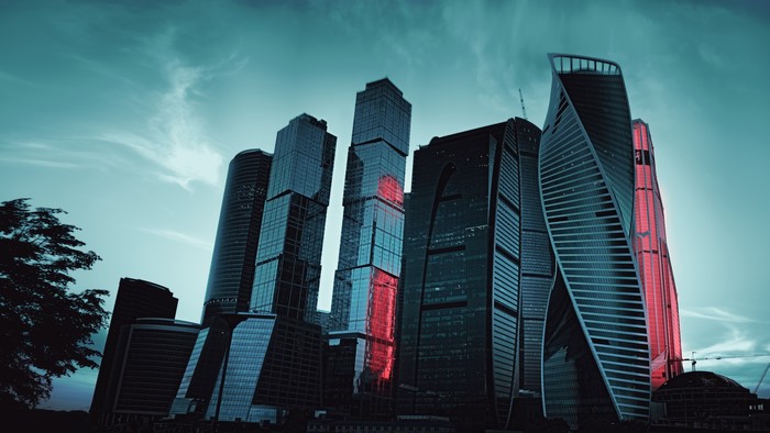 Moscow City skyscrapers at dusk with red lighting