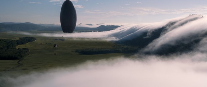 Arrival movie spaceship over a misty landscape