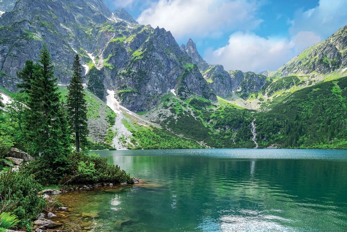 Serene Mountain Lake with Emerald Water and Pine Trees
