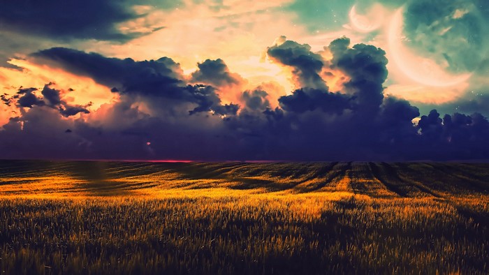 Fantasy landscape with crescent moons and stormy clouds
