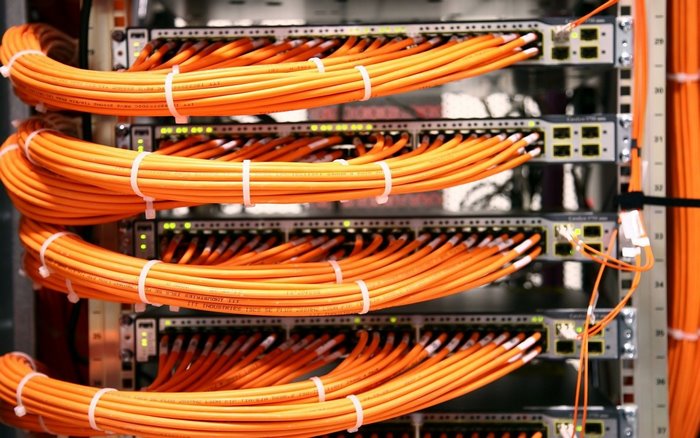 Network switches with orange fiber optic cables