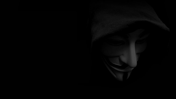 Guy Fawkes mask in darkness