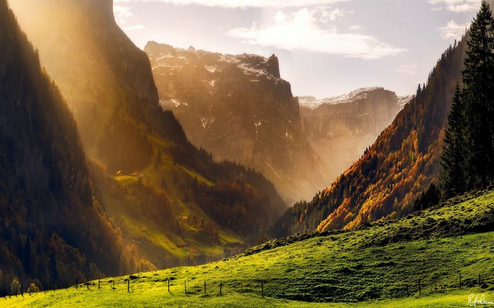 Mountain valley with sunbeams in the Alps
