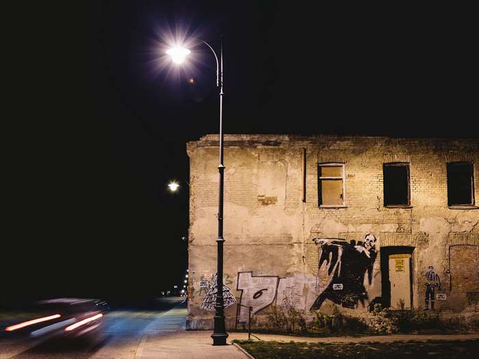 Graffiti on abandoned building at night in Bialystok