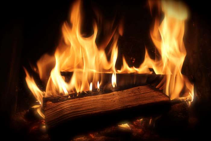 Fireplace with burning firewood and flames 4K
