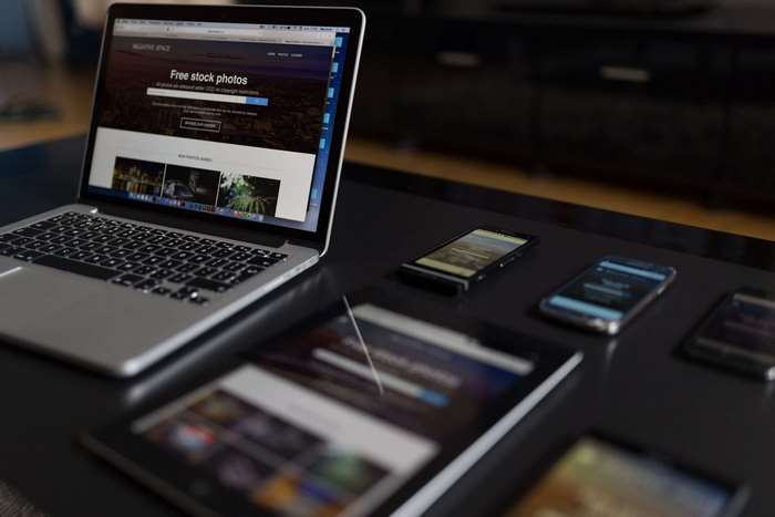 Laptop, tablet, and smartphones on a desk