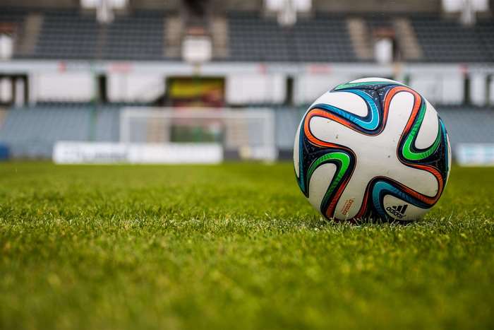 Soccer ball on a sports field in a stadium