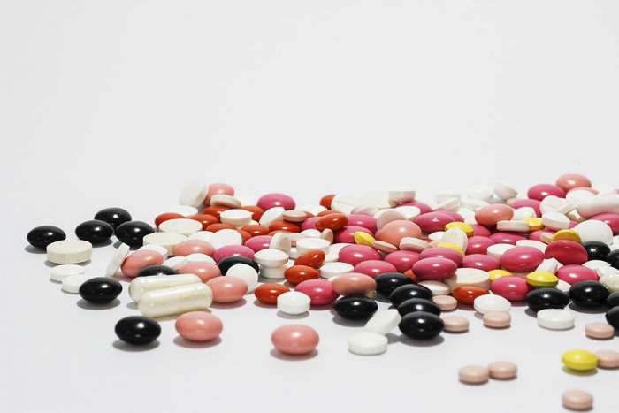 Pile of colorful medical pills and tablets 4K